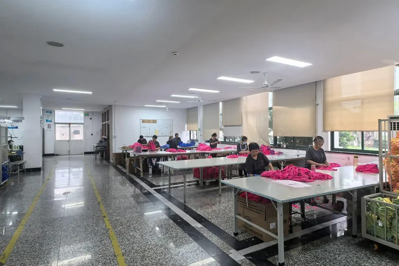 Factory team sorting and preparing custom towels for bulk orders