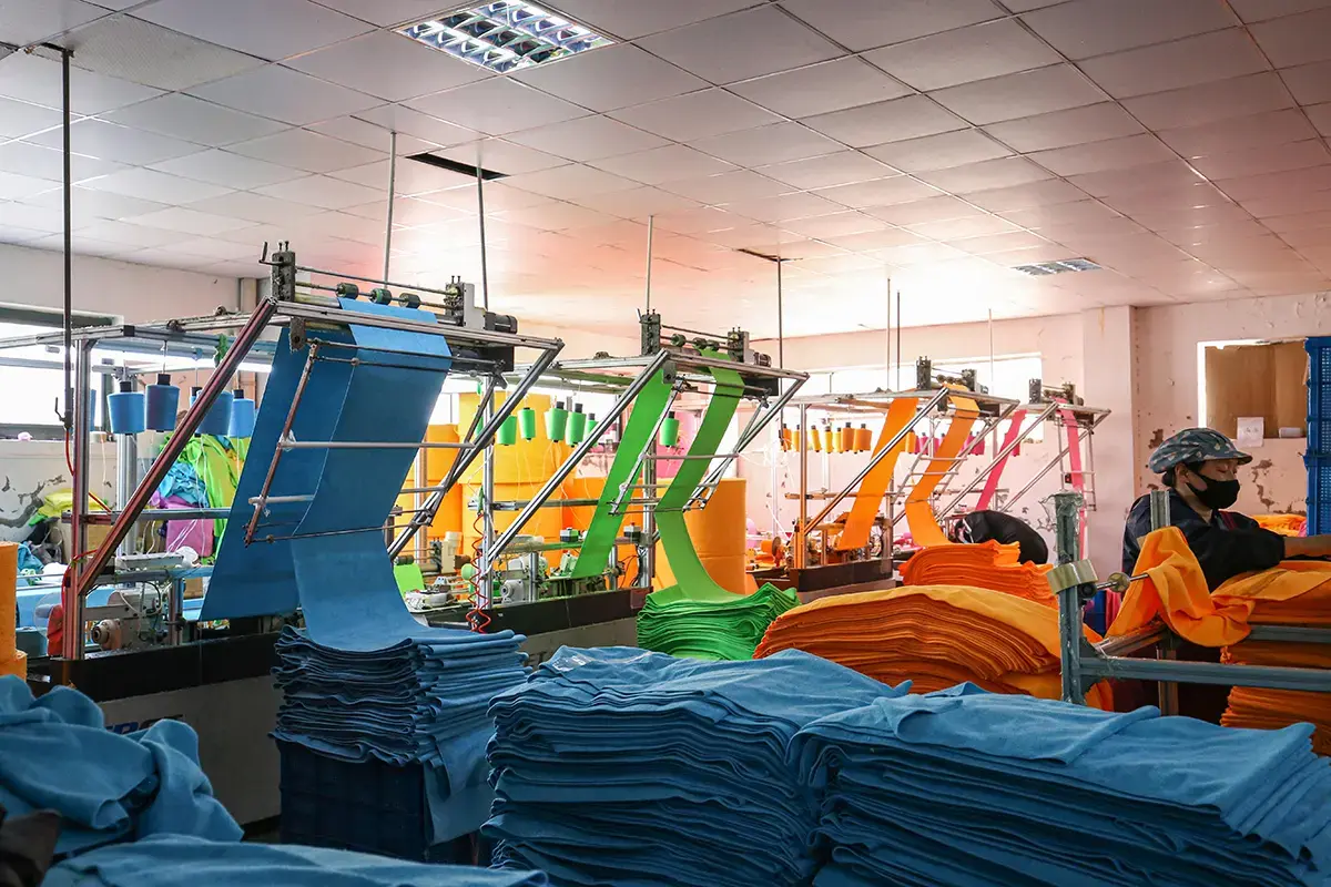 Colored bath towels being processed in the WiseTowel production workshop
