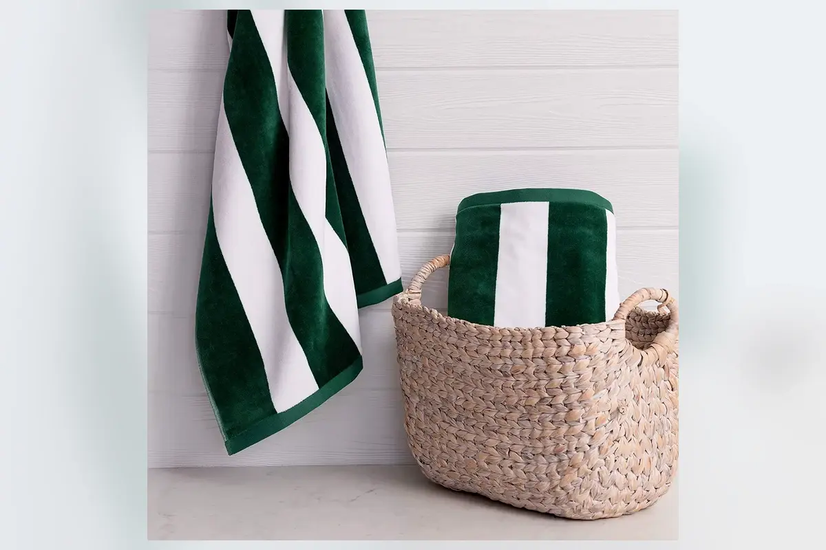 Green and white woven stripe towel showing jacquard pattern construction