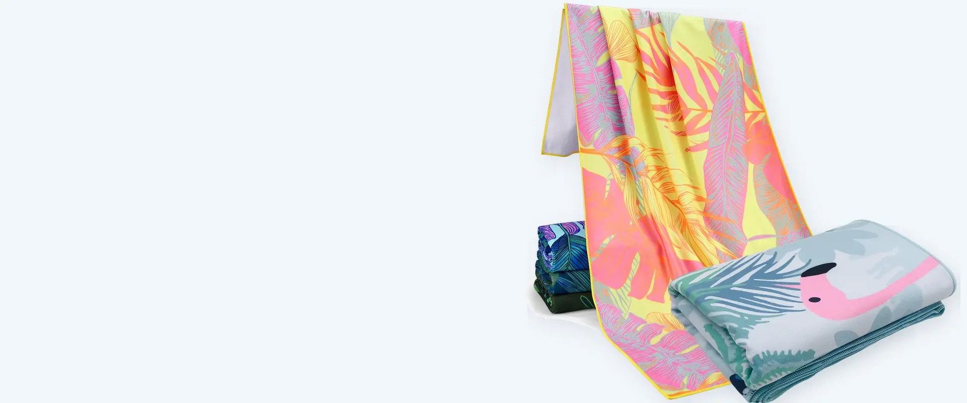 Custom printed beach towels with tropical and flamingo designs