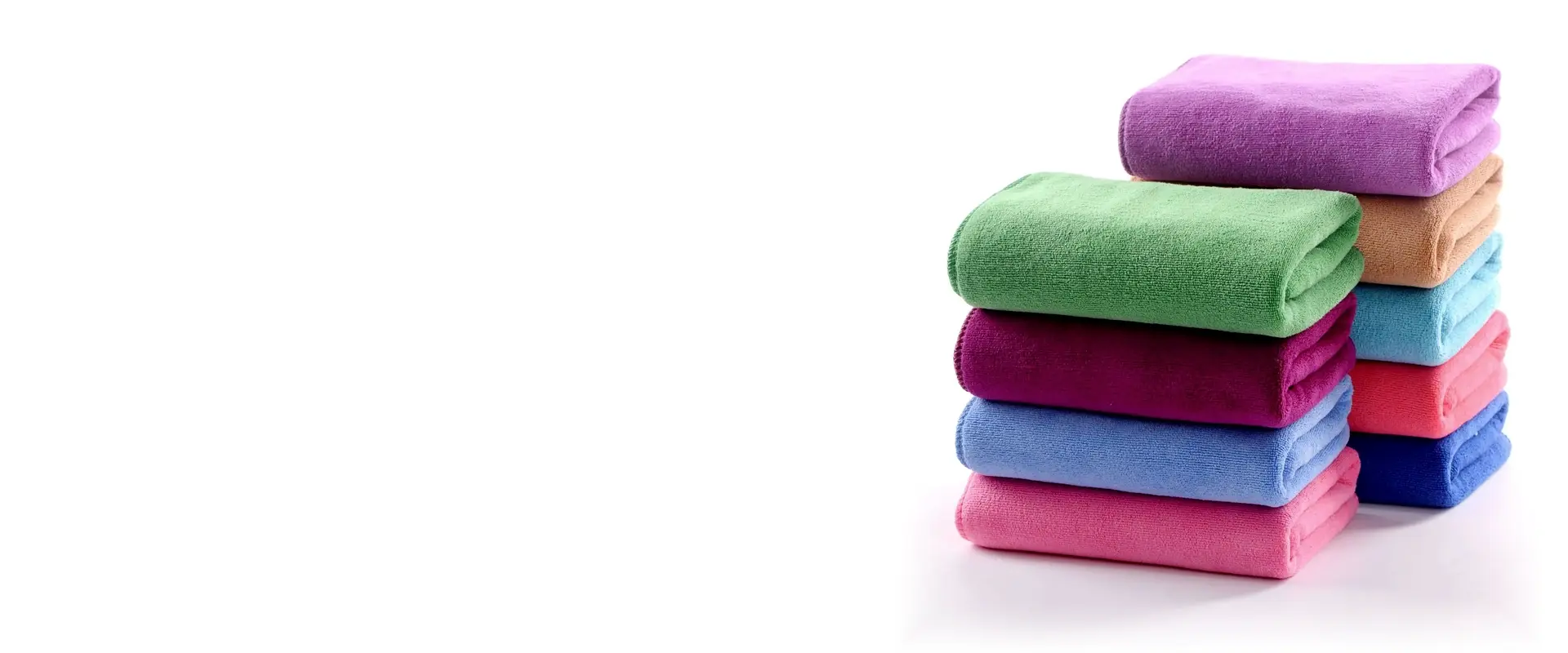 Colorful folded face towels in assorted solid colors