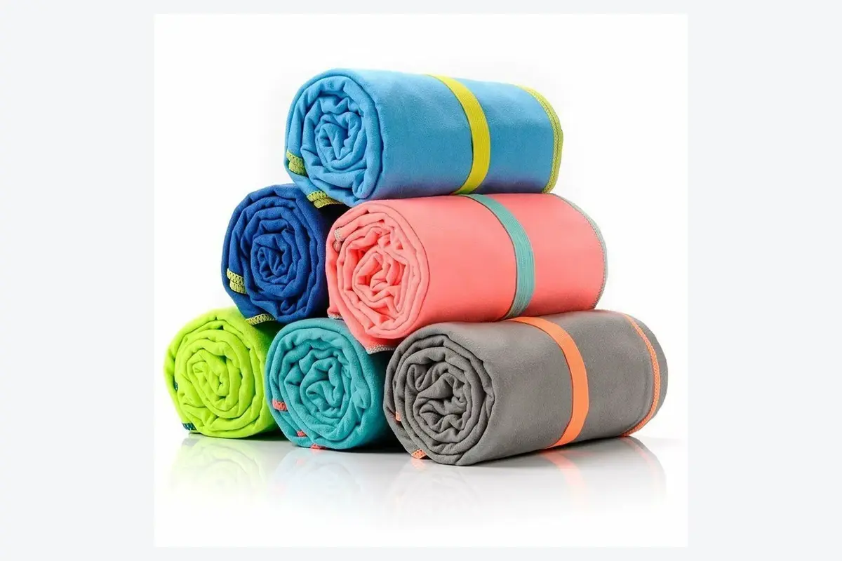 Color-coded rolled gym towels prepared as grouped club packs