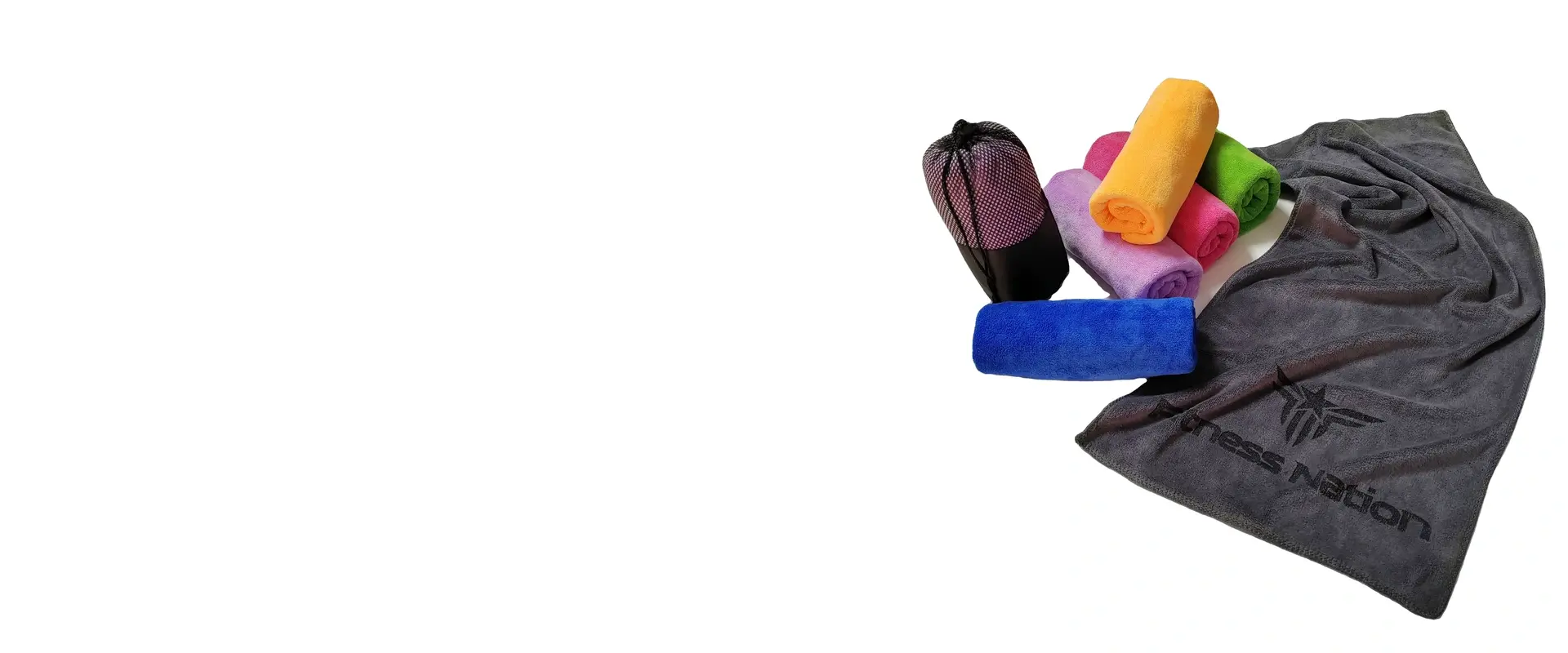 Custom gym towel set with colorful rolled towels, a logo towel, and a mesh carry bag