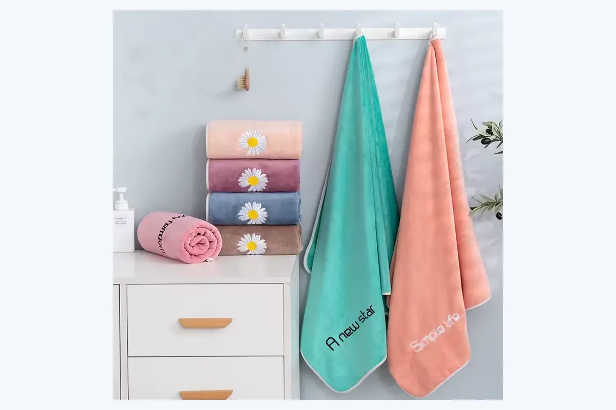 Custom hand towels displayed in folded and hanging formats