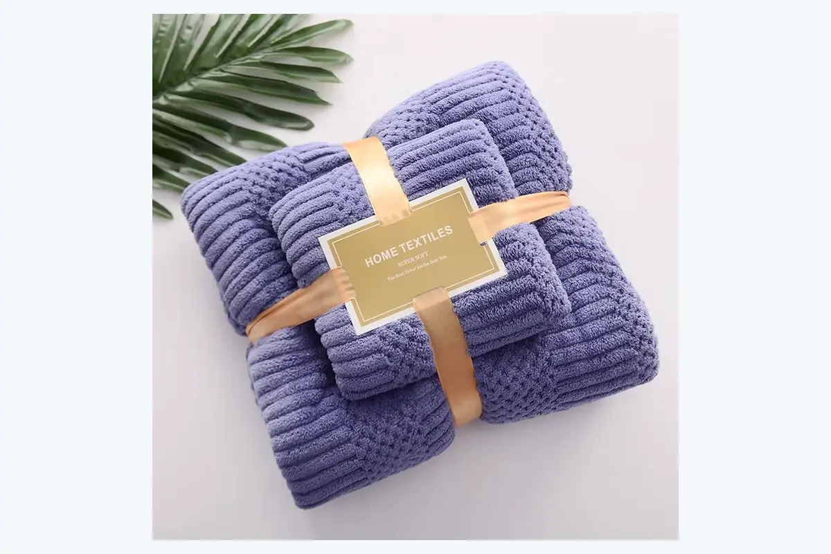 Folded hand towels secured with a kraft paper retail band