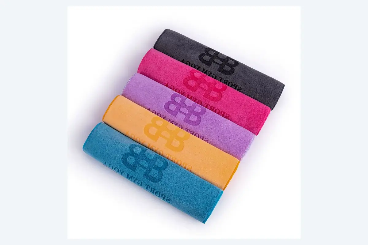 Branded fitness towels in several colors for hotel gyms and public areas