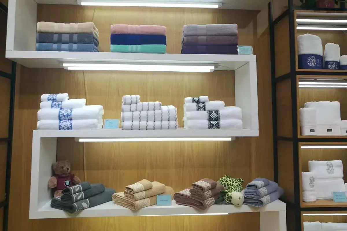 Hotel towel samples organized by size, color, border, and finish in a sample room