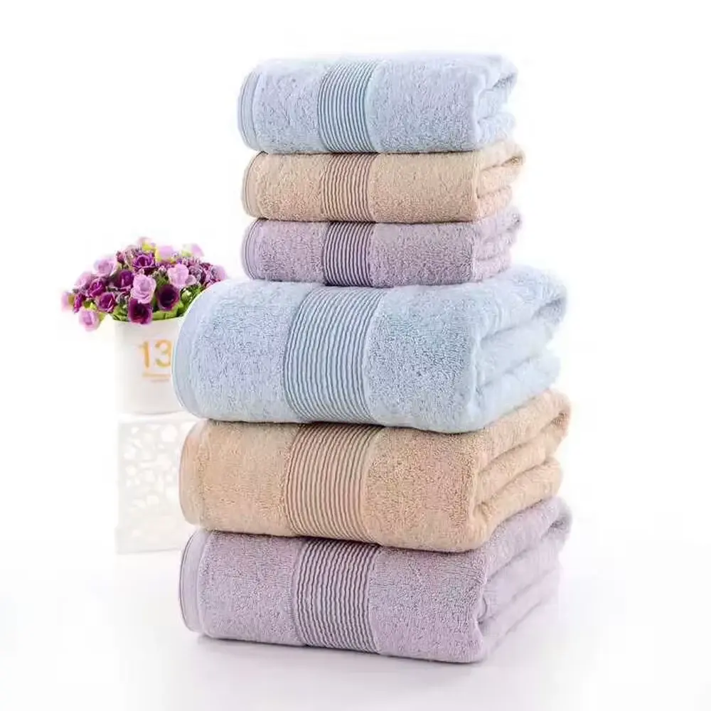 Stack of soft pastel bath towels in coordinated sizes