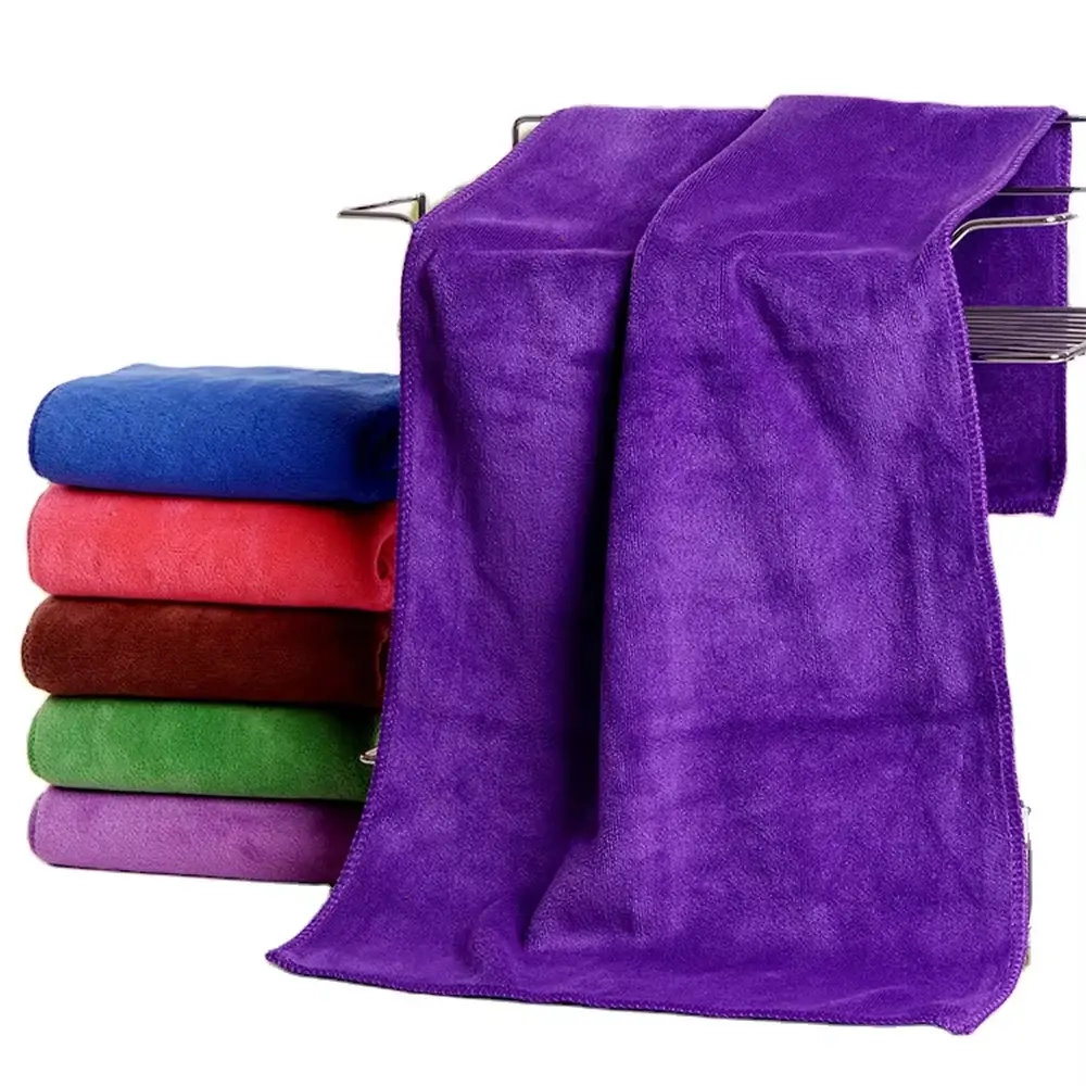 Plush purple spa towels displayed in multiple sizes