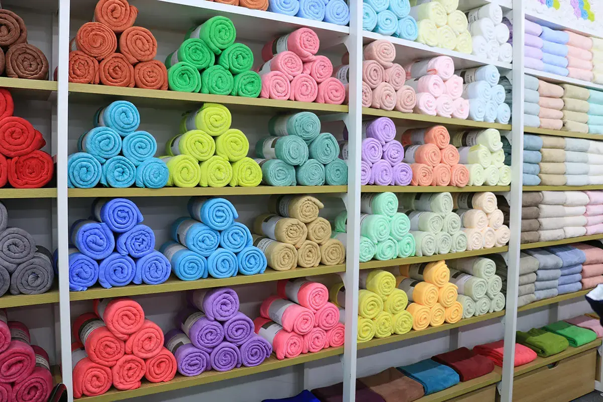 Rolled custom towel samples displayed in a wide range of colors
