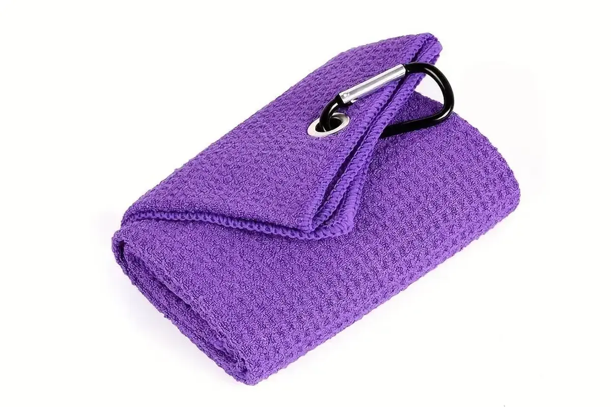 Purple sports towel showing contrasting black edge finish and attachment