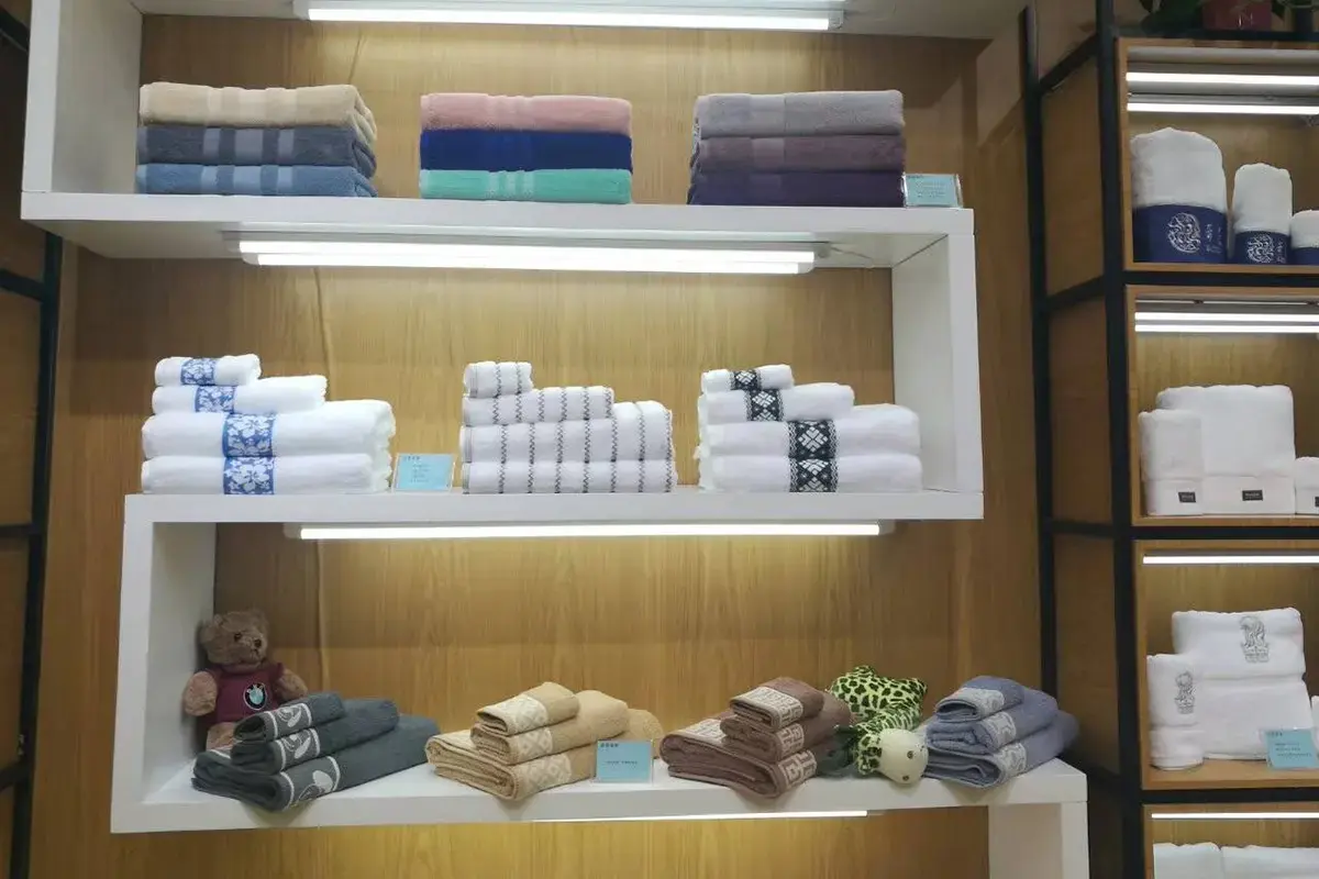 Custom towel samples displayed in different finished sizes and folded configurations