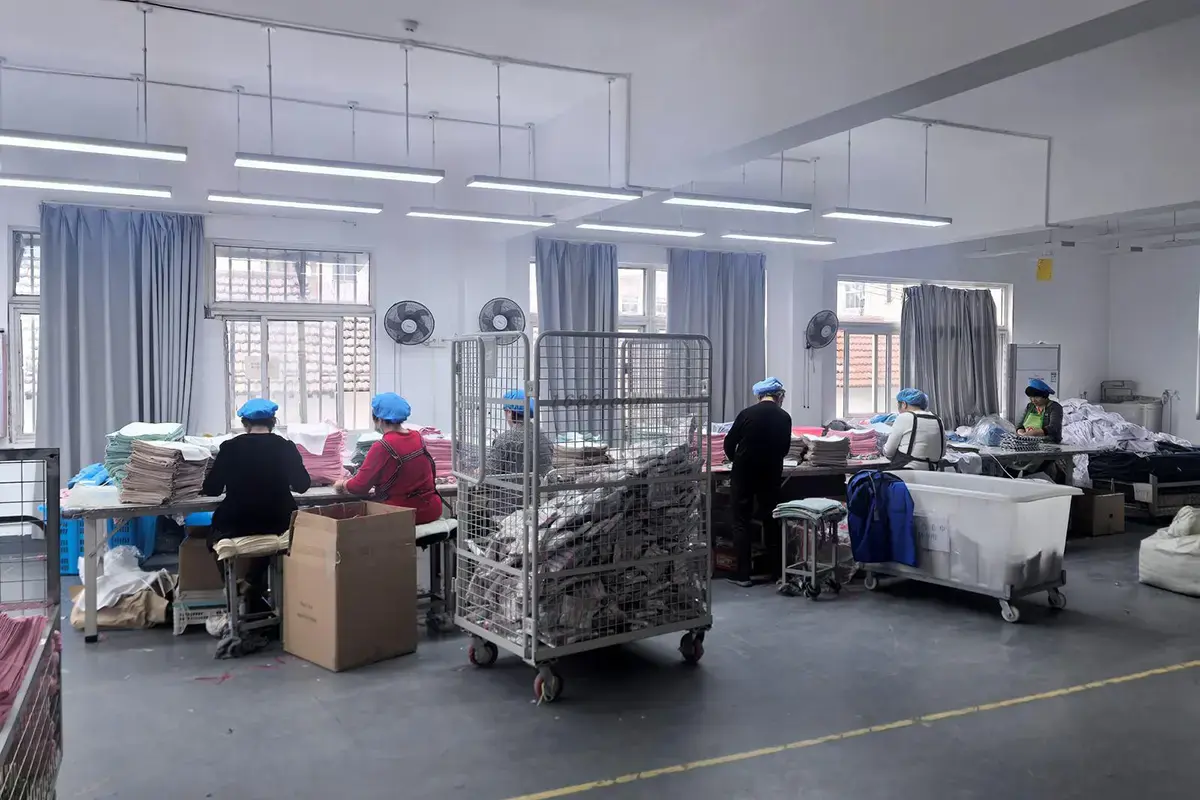 Workers sorting finished towels during size and quality inspection