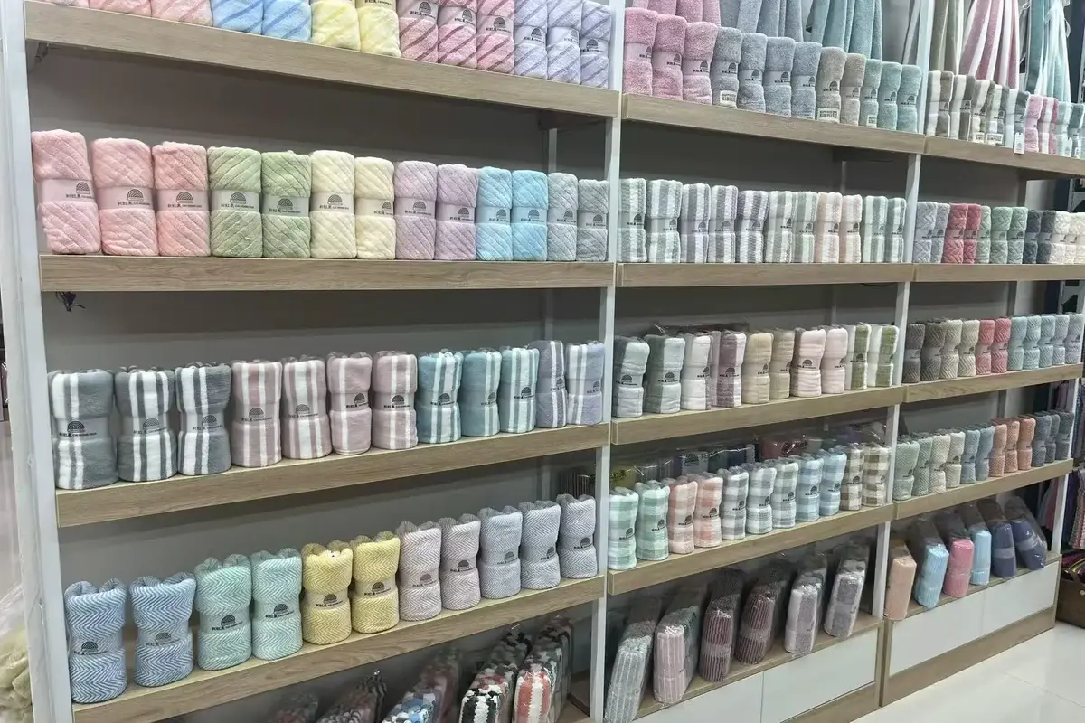 Rolled towel samples arranged to compare size, material, and weight