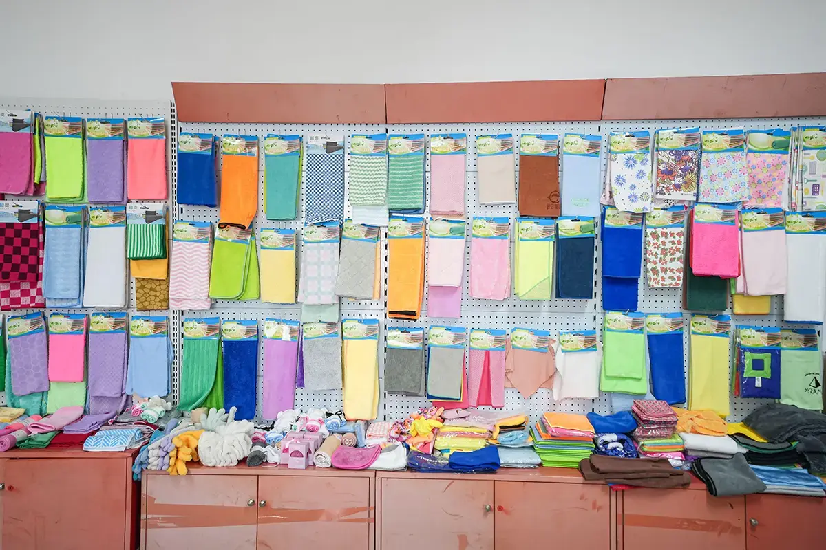 Towel samples in varied sizes, colors, patterns, and edge finishes displayed together