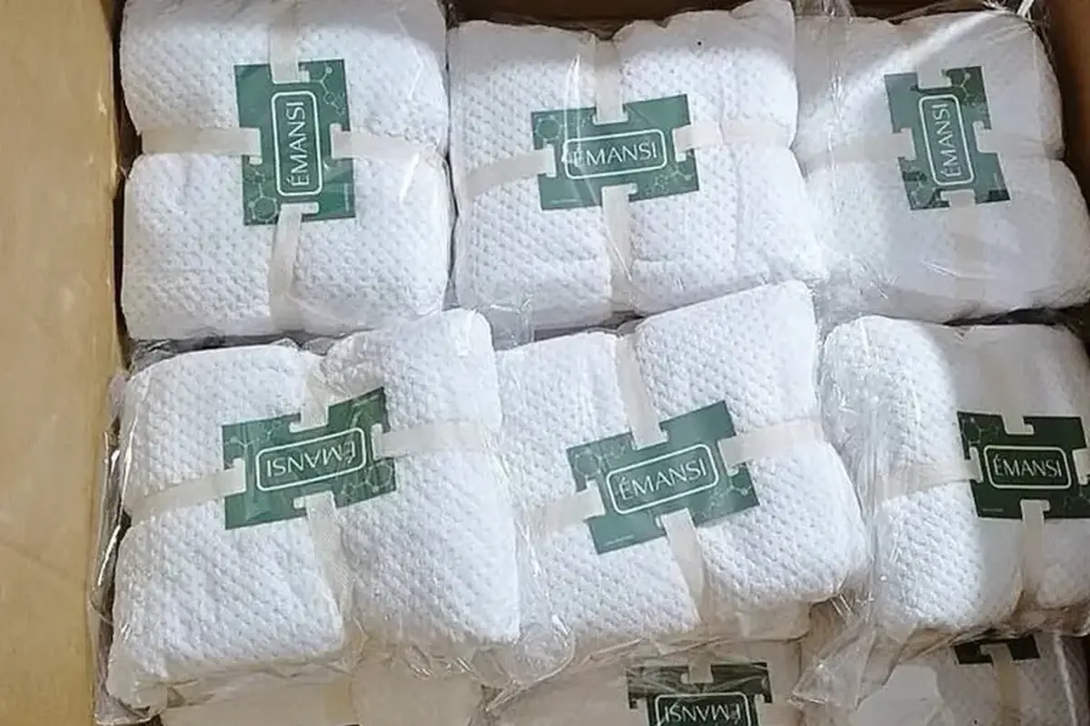 Folded towels packed with branded paper bands for private label presentation