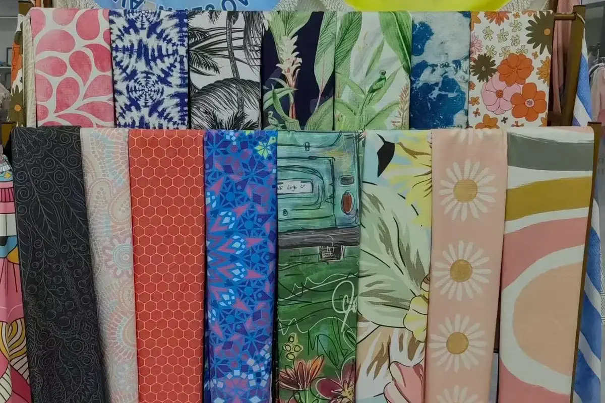 Fabric pattern samples arranged to compare design scale and repeat