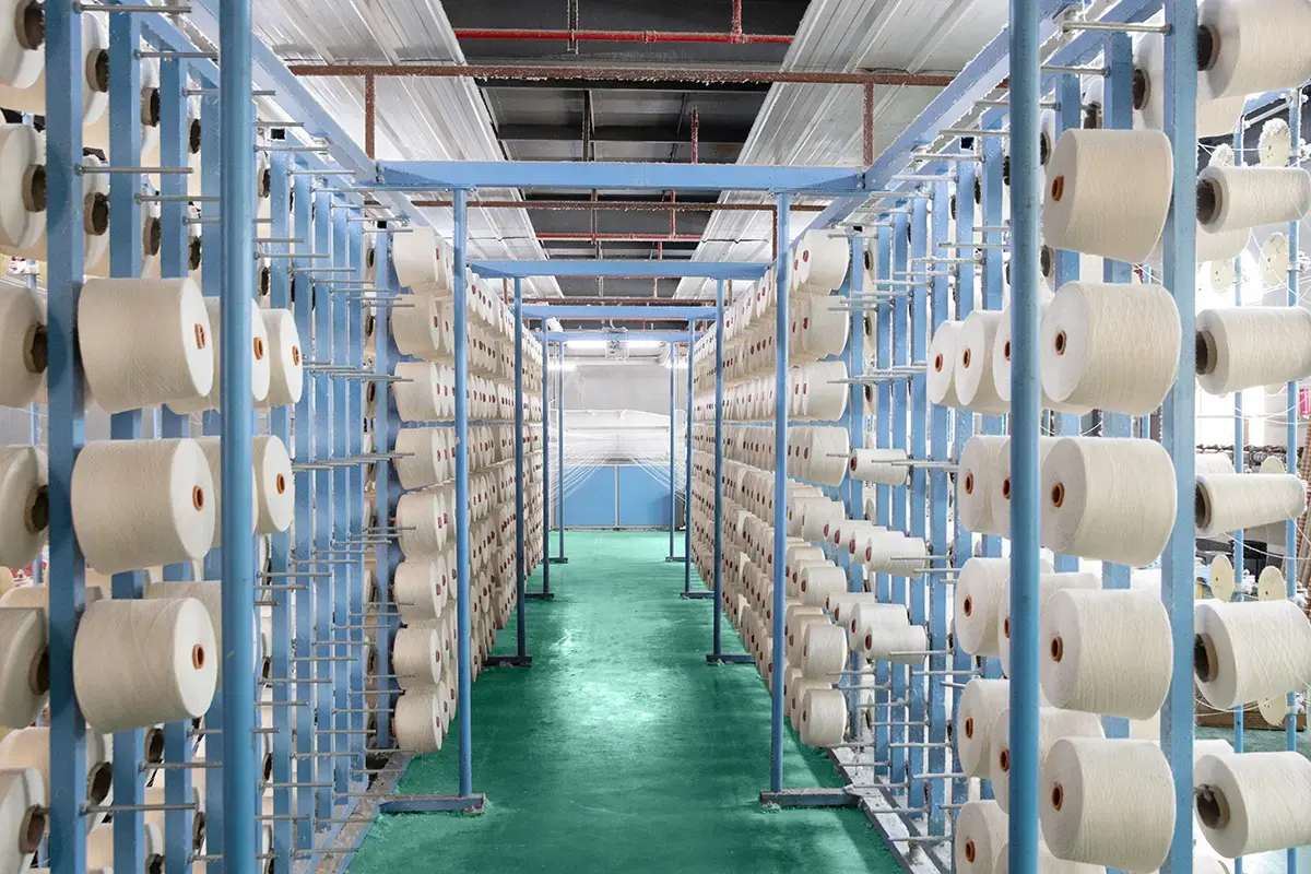Yarn cones arranged in a textile factory for custom towel material production