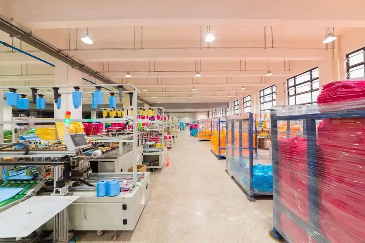 Custom towel production line operating with color batches staged for bulk output
