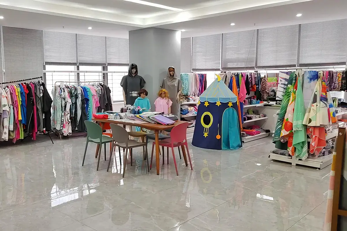 Custom product sample room with towel options arranged around a development table