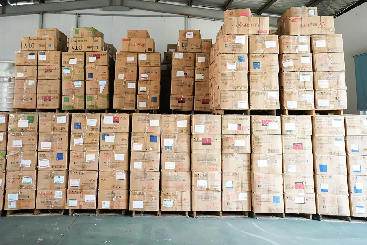 Labeled finished-goods cartons organized for order and evidence traceability